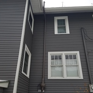 Radon mitigation system outside home.
