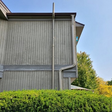 Radon mitigation system outside home.
