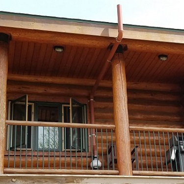 Radon mitigation system outside home.