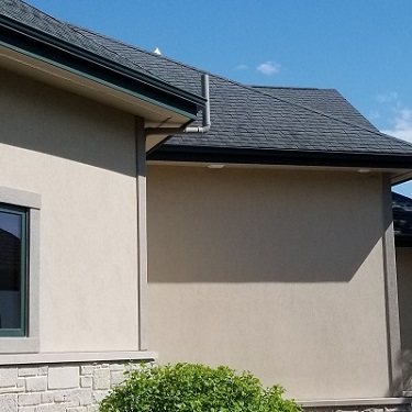 Radon mitigation system outside home.