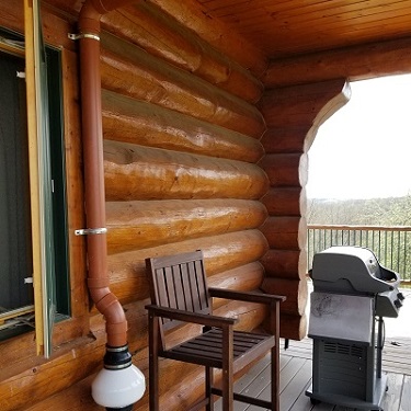 Radon mitigation system outside home.