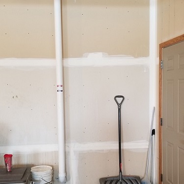 Radon mitigation system inside home.