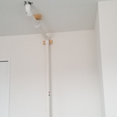 Radon mitigation system inside home.
