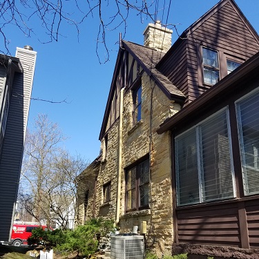 Radon mitigation system outside home.