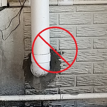 Chiseled through the outside wall causing unnecessary damage to the concrete foundation